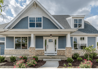 a house with a blue sky and clouds